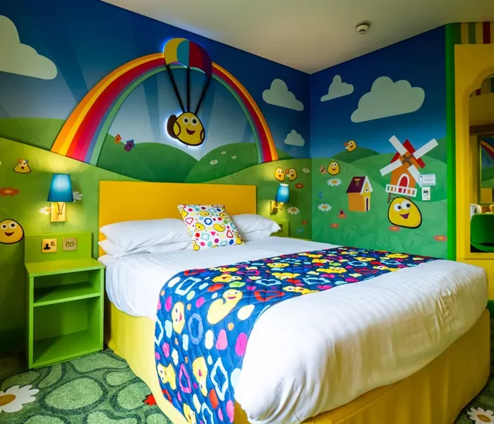 a bright room with yellow cartoon style characters on the wall created on a animated country side image