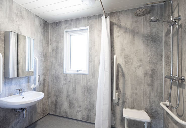 Accessible bathroom with safety features and modern design.