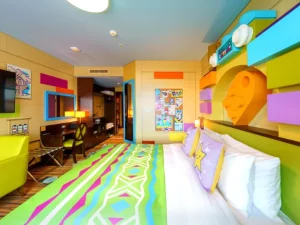 Colorful, vibrant themed hotel room with artistic decor.