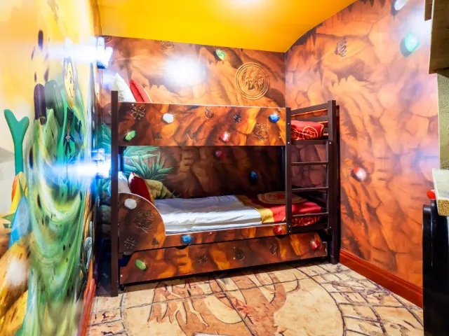 Colorful jungle-themed children's bunk bed room.