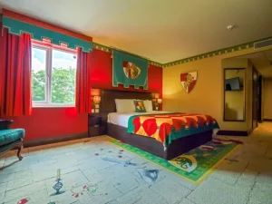 Colorful medieval-themed hotel room with intricate decorations.