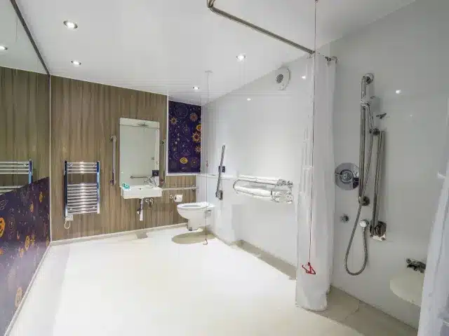 Accessible bathroom with safety features and modern design.