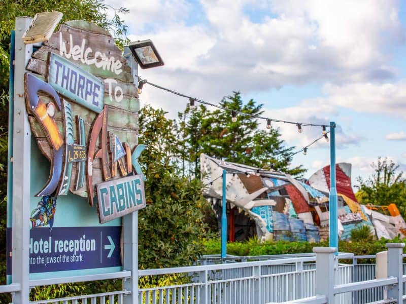 Colorful welcome sign at Thorpe Park with cabana directions.