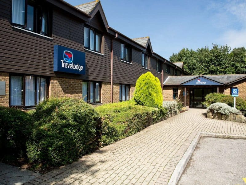 Travelodge hotel exterior with landscaped entrance.