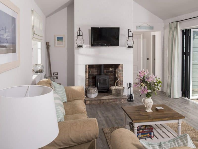 Cozy living room with fireplace and modern decor.