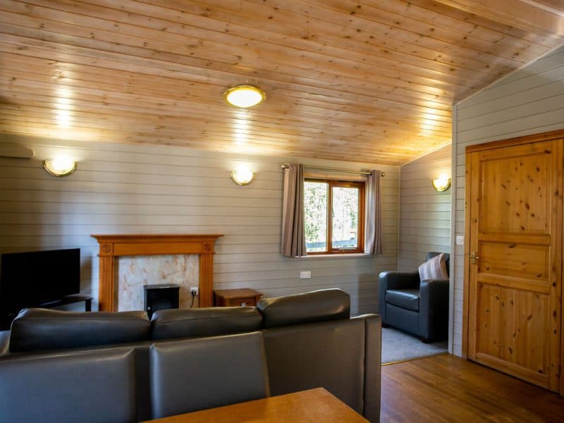 Cozy wooden cabin interior with modern amenities.