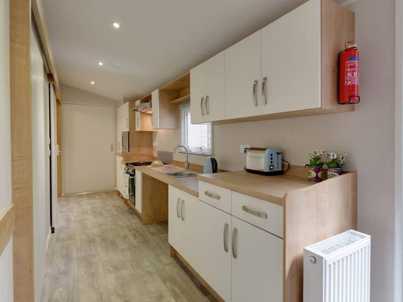 Modern compact kitchen interior in minimalist design.