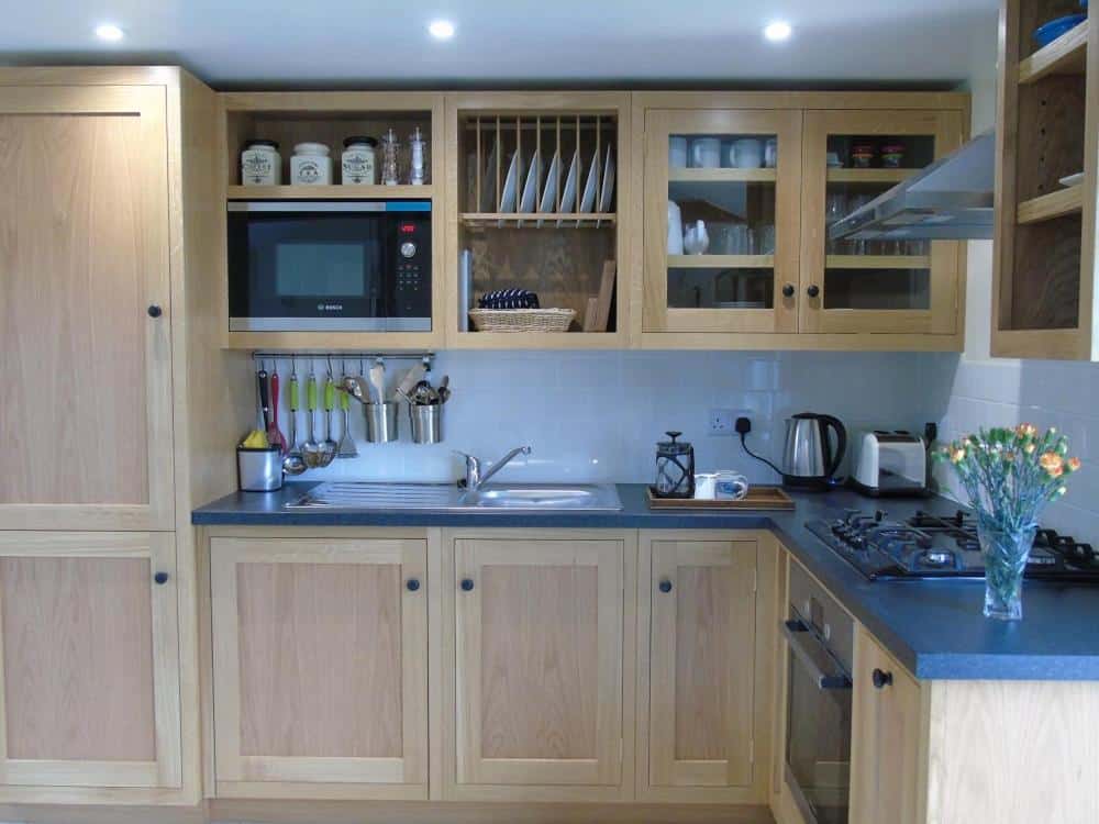 Modern kitchen with wooden cabinets and blue countertops