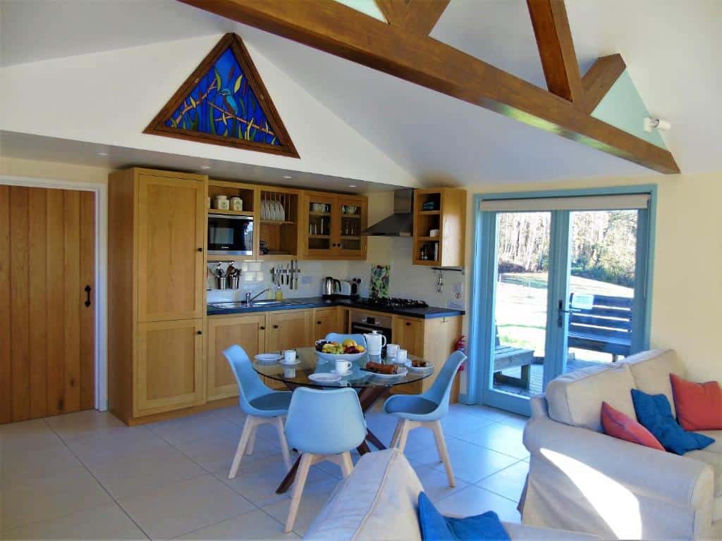 Bright, modern kitchen with dining and living area