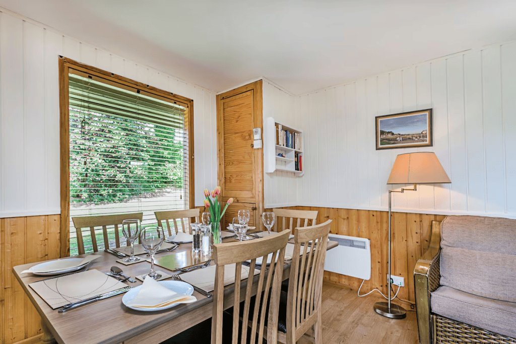 Bright cozy dining room with wooden accents and decor