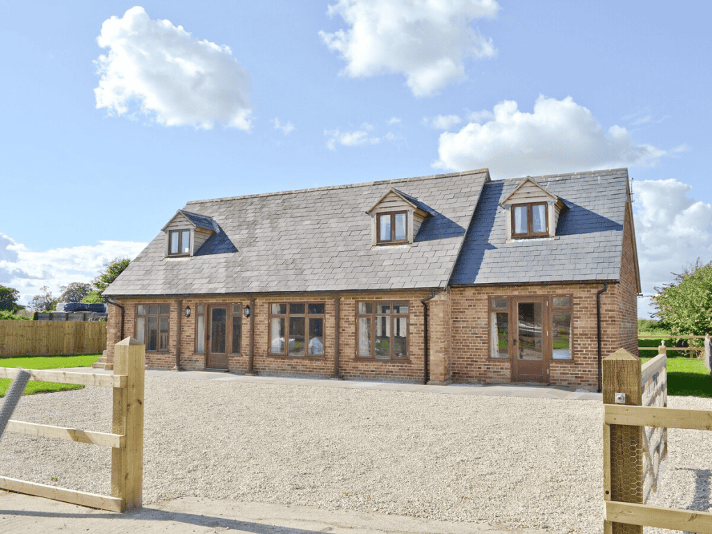 Modern countryside brick house with slate roof