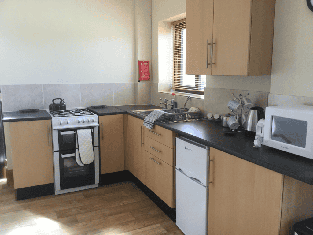 Well-equipped kitchen with modern appliances and wooden cabinets