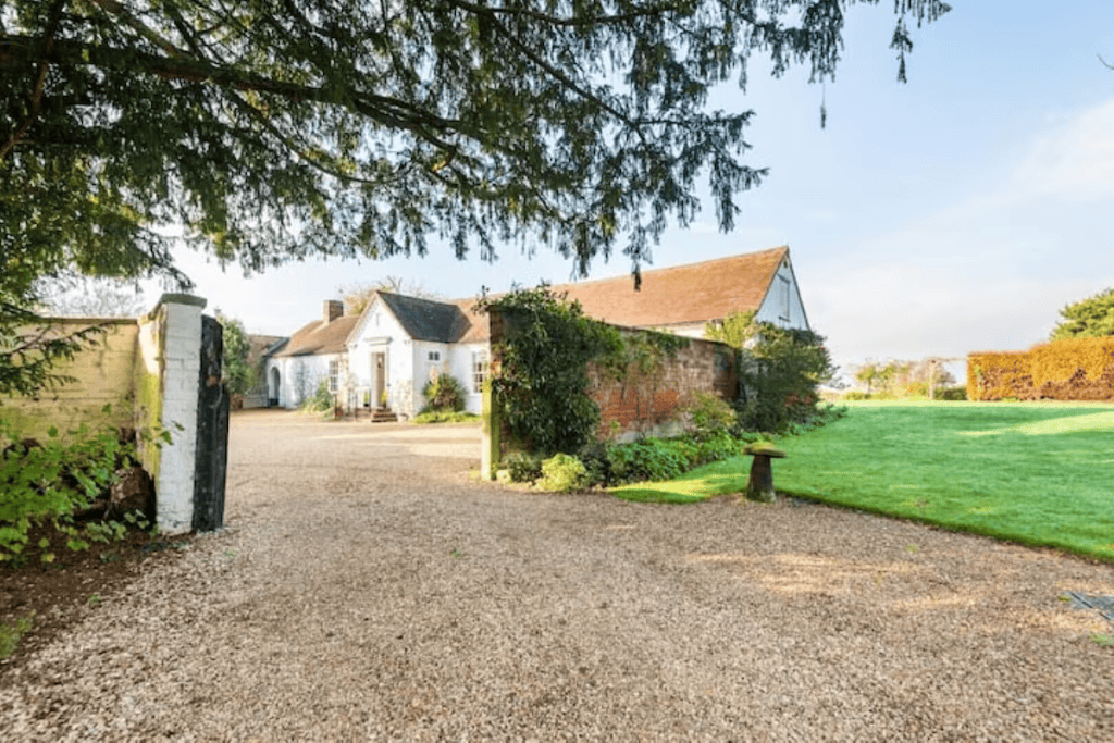 Picturesque English country house with landscaped garden