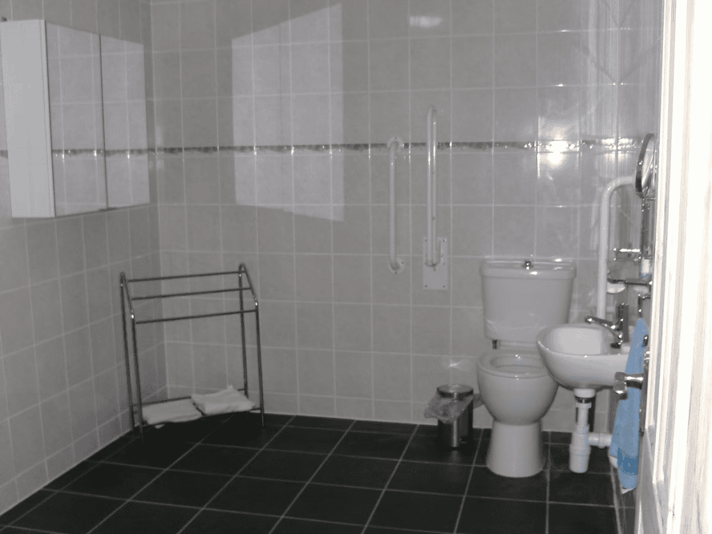 Modern bathroom with white fixtures and gray tiles