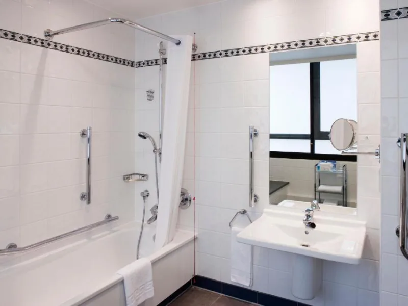 Modern bathroom with tub, shower and sink