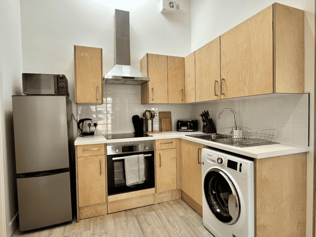 Modern kitchen with wooden cabinets and stainless appliances