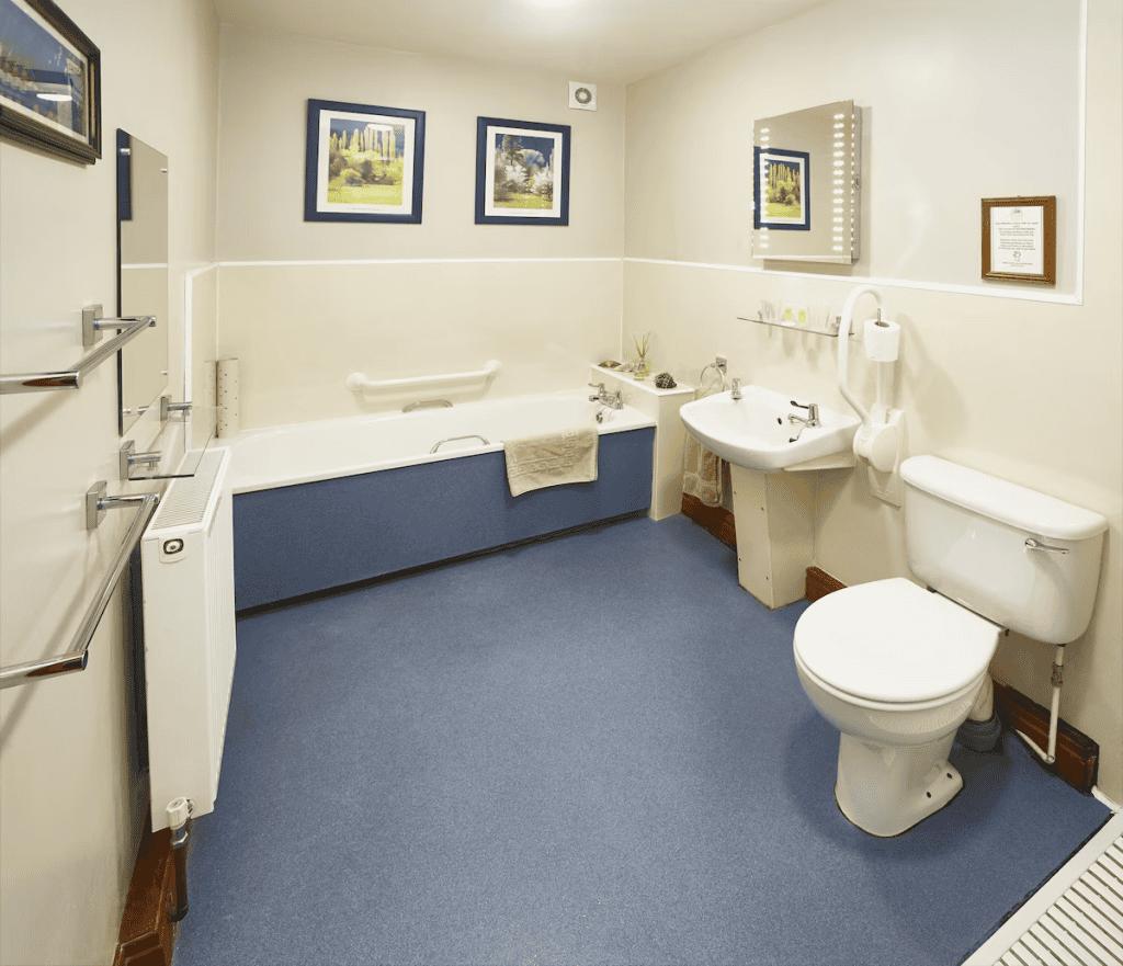 Spacious bathroom with tub, sink, and toilet