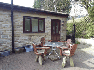 Cozy stone cottage with outdoor seating area