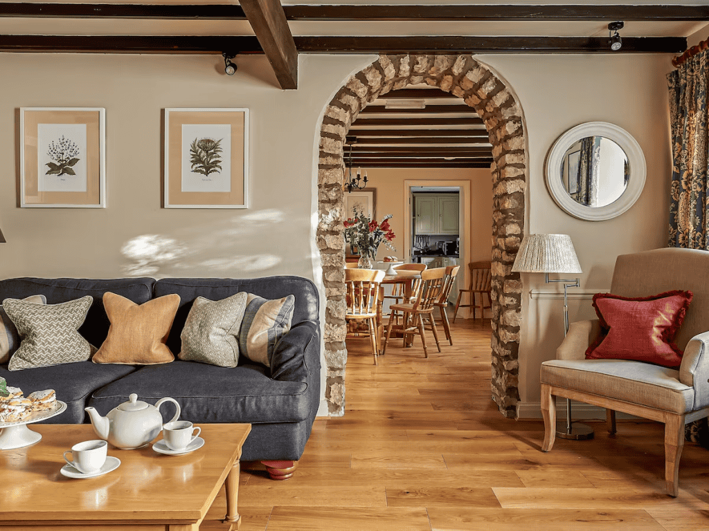 Cozy living room with archway leading to dining area