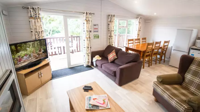 Cozy living room with open doors leading to balcony