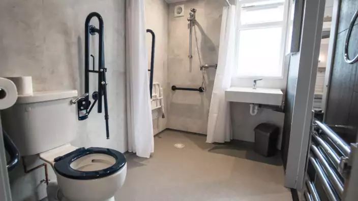 Accessible bathroom with safety handles and fixtures