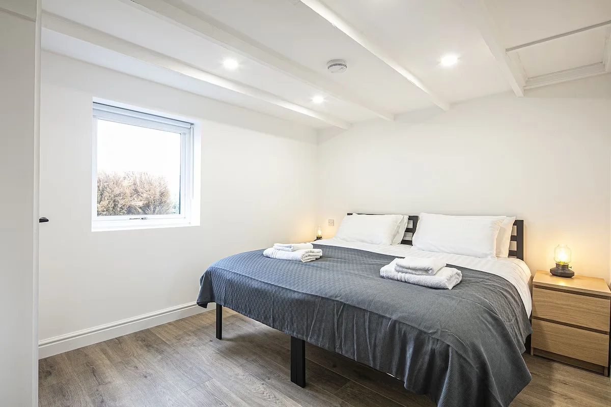 Large twin/Double bed with space to the sides of the bed and the foot of the bed