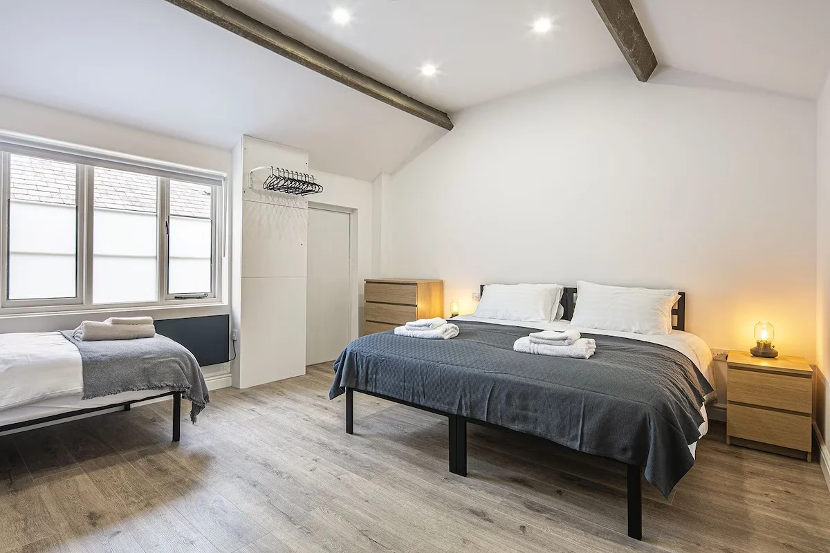 Large twin/Double and single bed with space to the sides of the bed and the foot of the bed