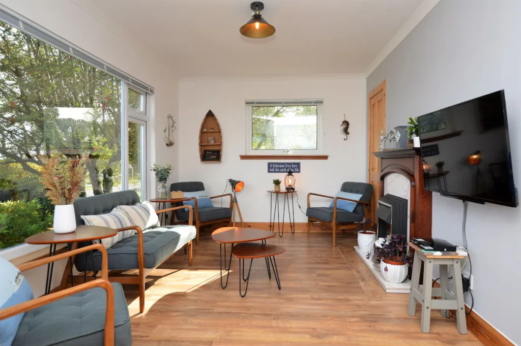 Bright living room with modern furniture and large windows