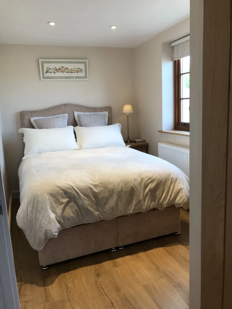 Double bed with space to the side and foot of the bed