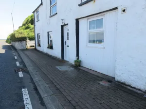 White coastal houses with street view on sunny day