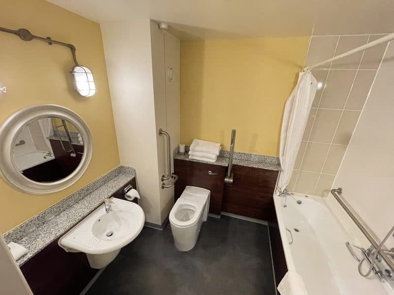 Spacious bathroom interior with modern fixtures and lighting