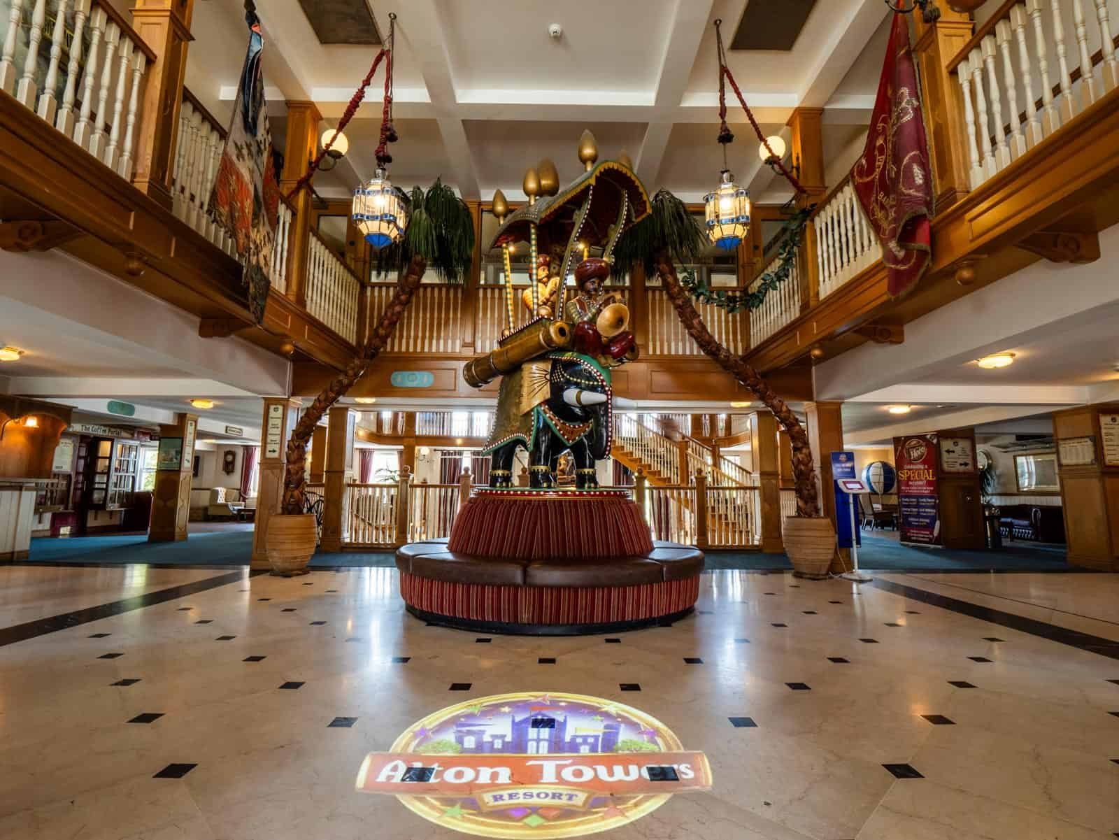 Colorful carousel horse inside Alton Towers Resort lobby.