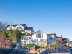 Hillside homes under clear blue sky