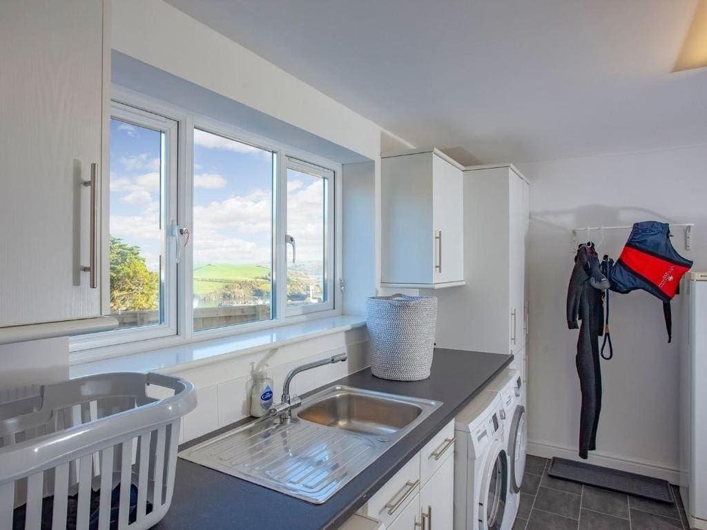 Bright kitchen with scenic view and modern appliances