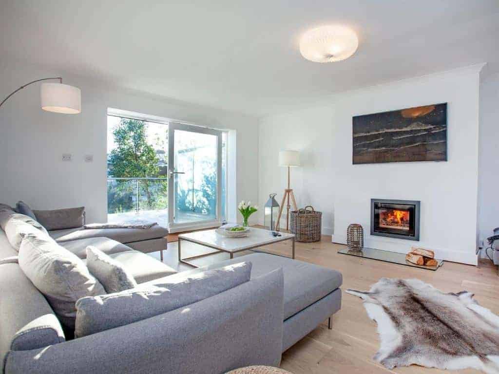 Bright living room with modern decor and fireplace