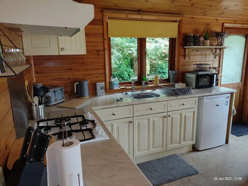 Cozy wooden cabin kitchen with modern appliances