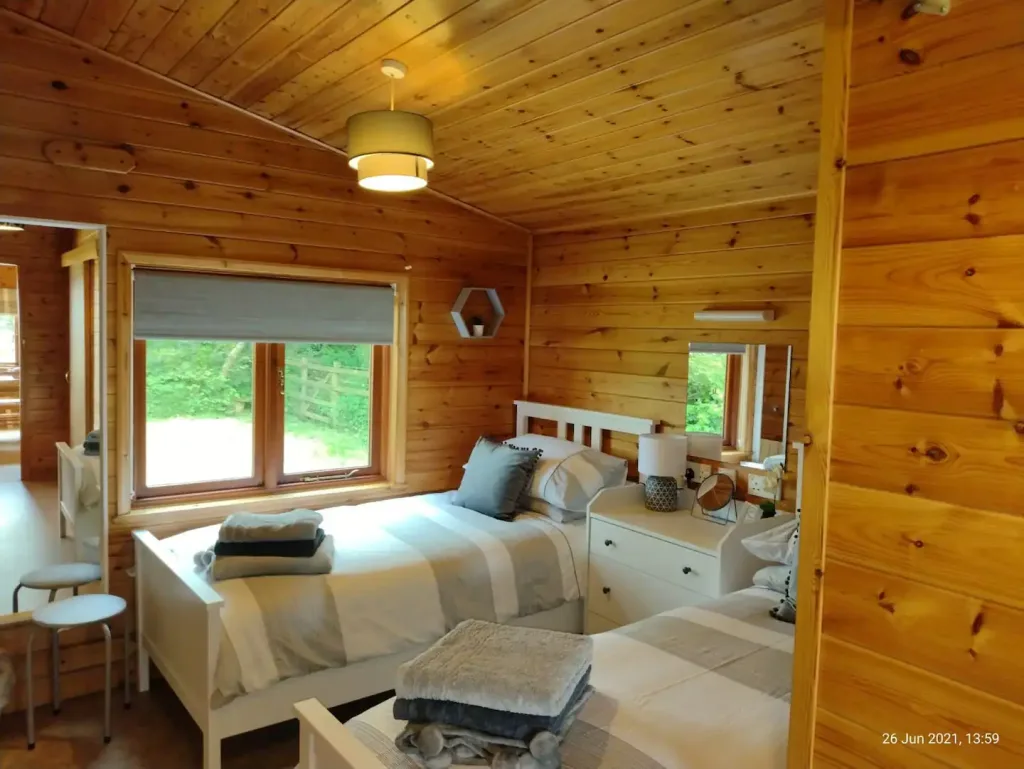 Cozy wooden cabin bedroom with natural light