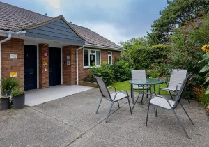 Suburban bungalow with outdoor table and chairs