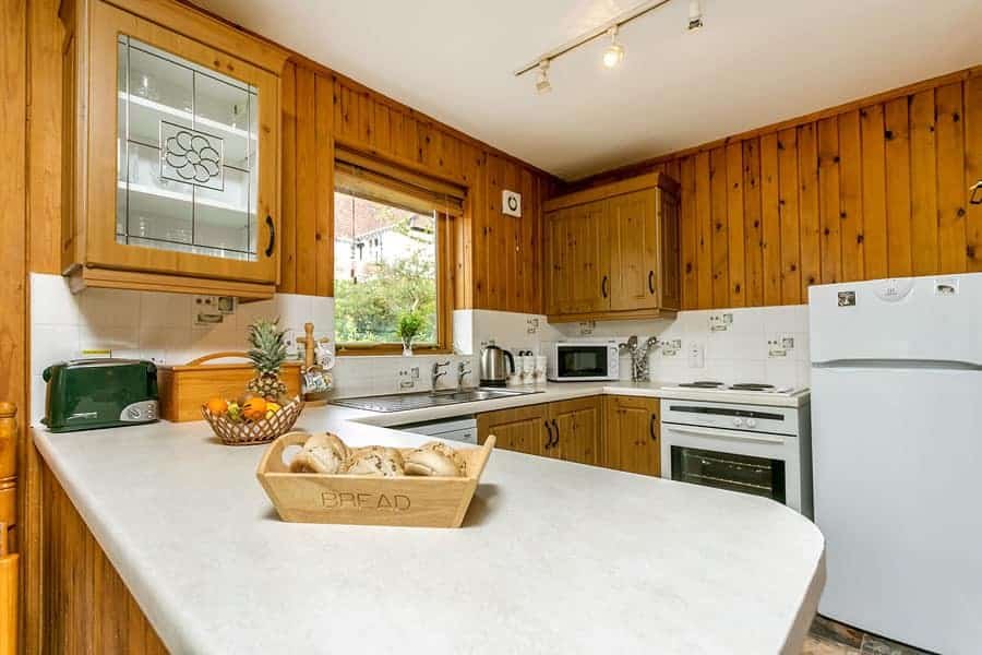 Cozy wooden kitchen interior with modern appliances