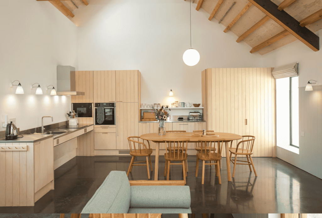 Modern kitchen with wooden furniture and exposed beams