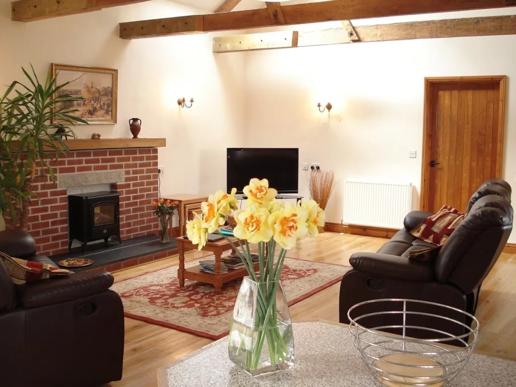 Cozy living room with fireplace and wooden beams