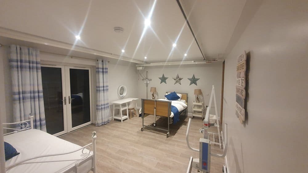 Spacious hospital room with two beds and modern amenities