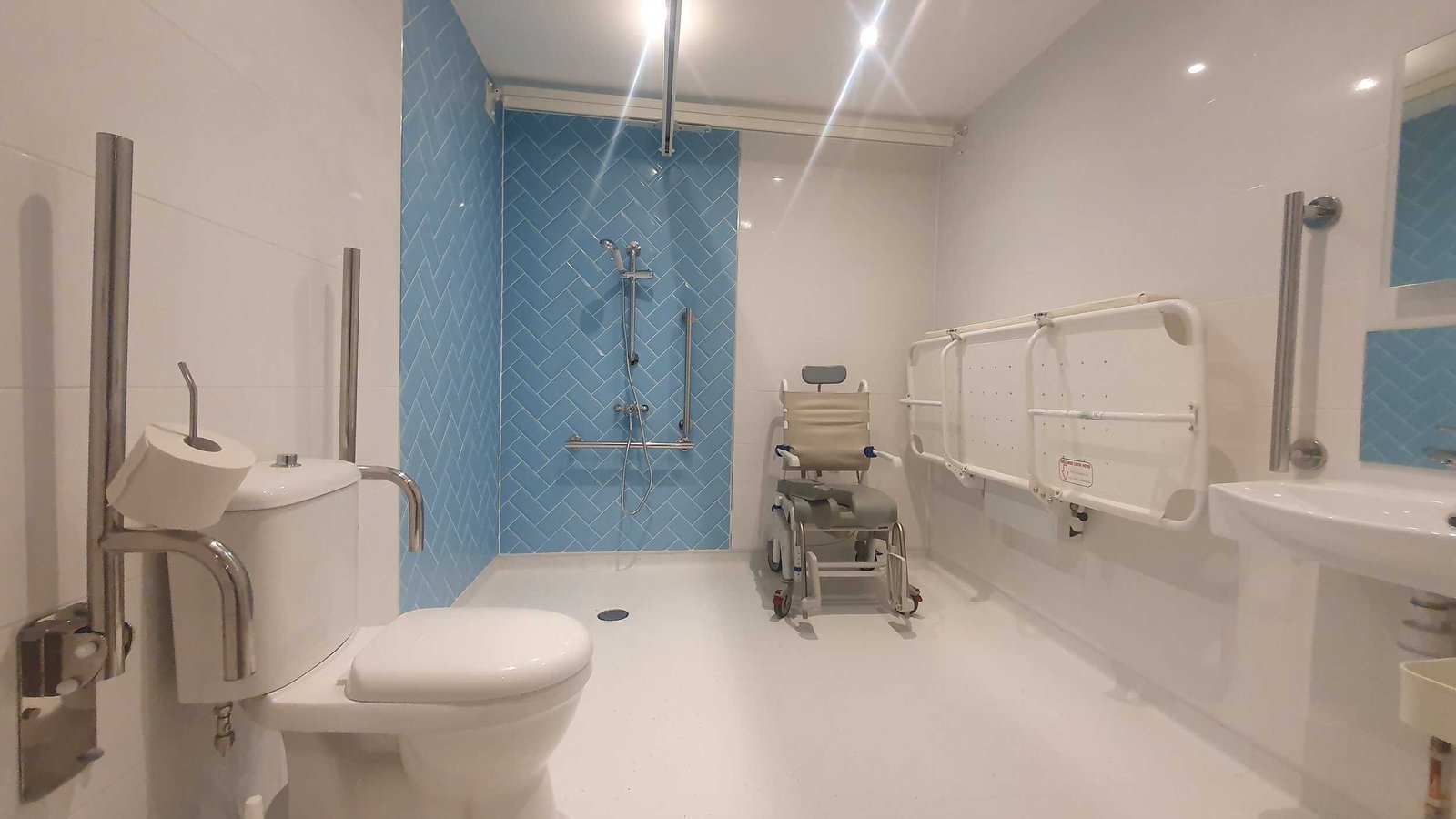 Accessible bathroom with wheelchair and safety features