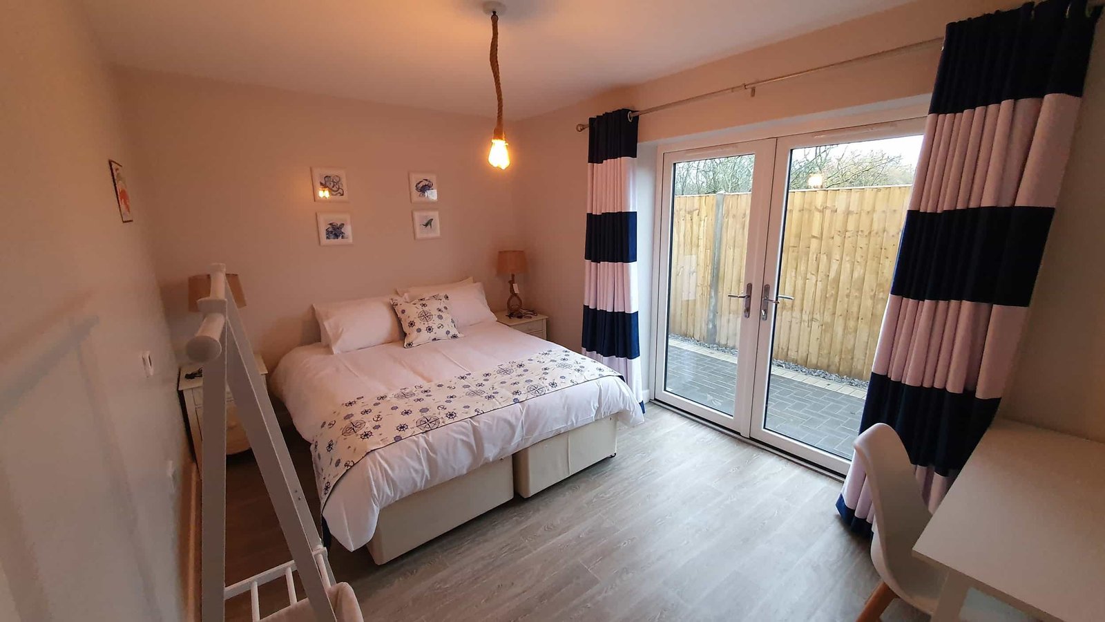 Cozy bedroom with double bed and modern decor