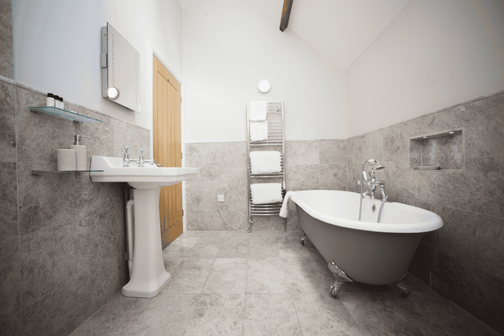 Elegant bathroom with freestanding tub and marble tiles