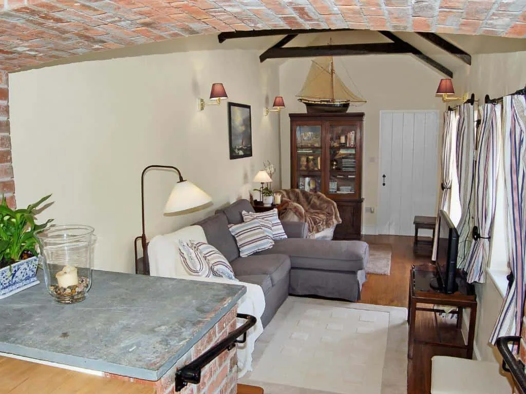 Cozy living room with exposed brick and wood beams