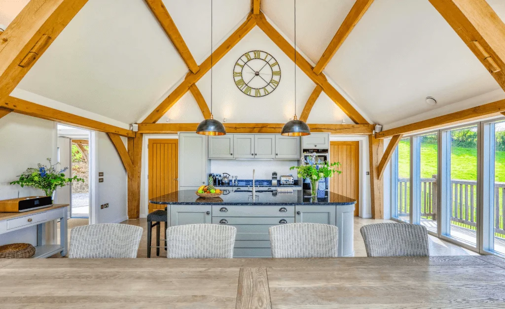 Spacious kitchen with wooden beams and modern amenities