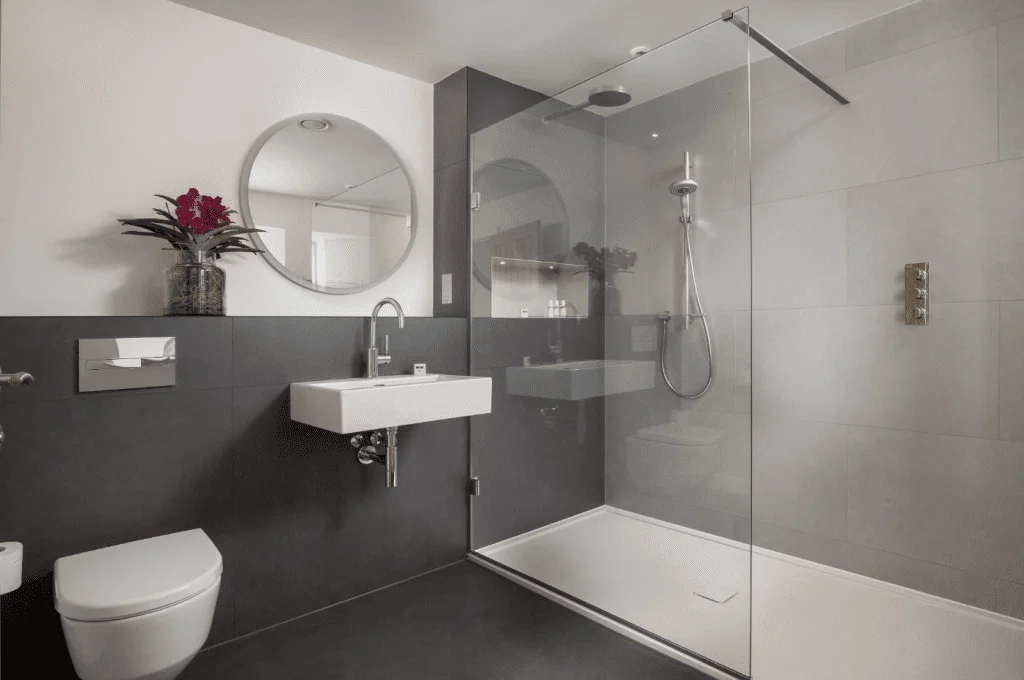 Modern bathroom with shower, sink, and mirror
