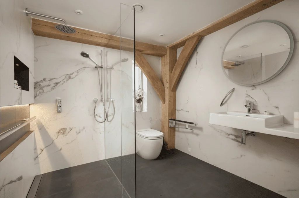Modern bathroom with marble walls and wooden accents