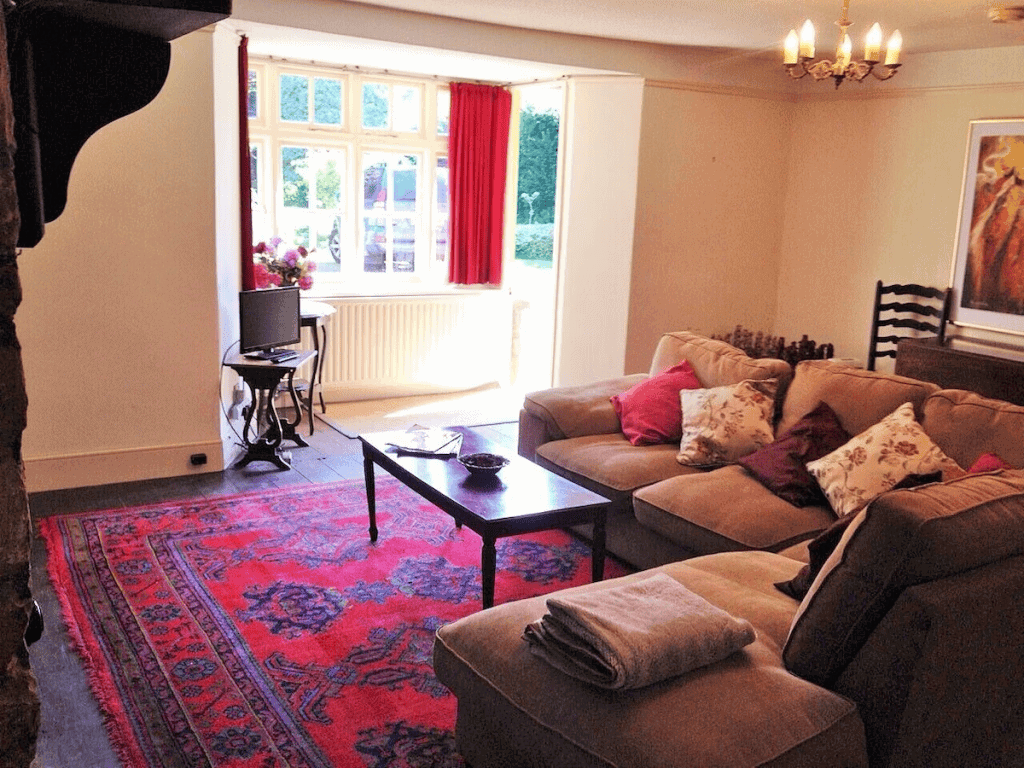 Cozy living room with red accents and elegant decor